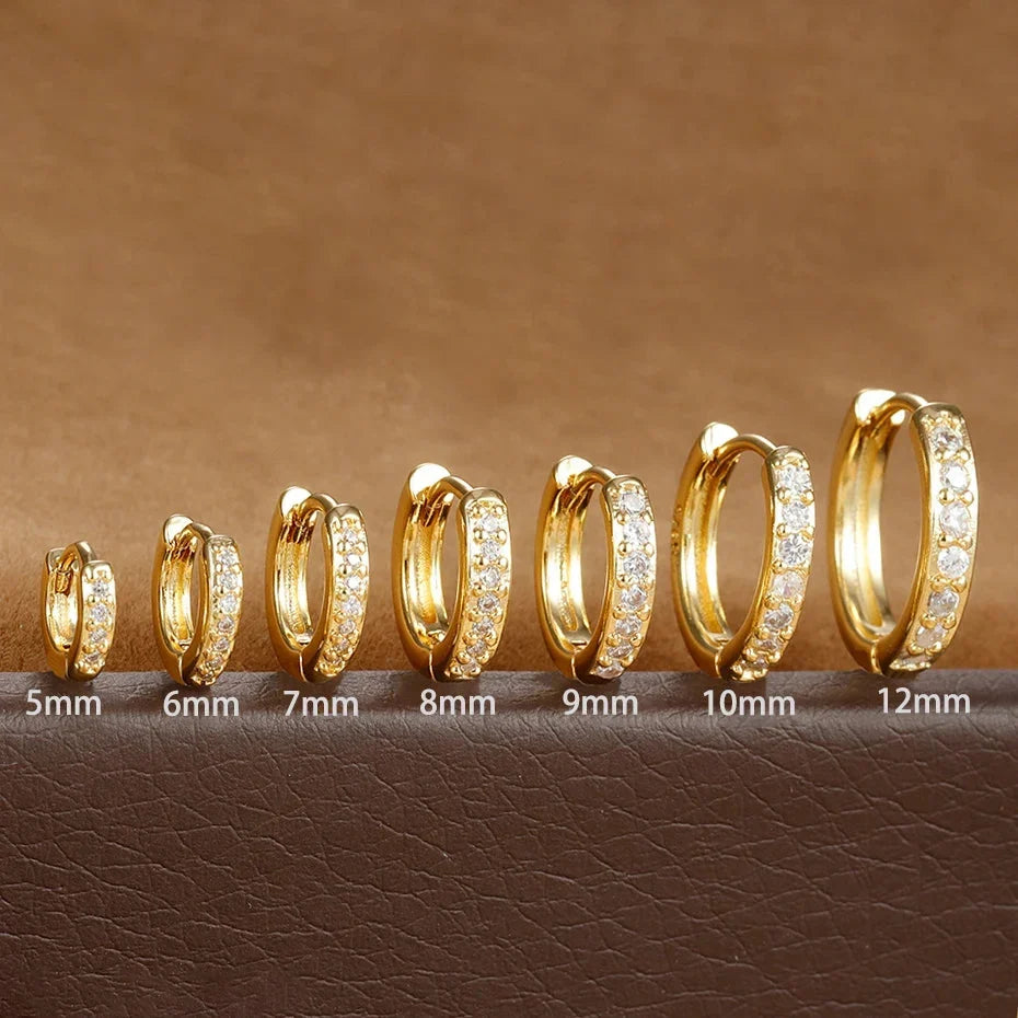 Crystal huggie hoop earrings in multiple finishes and sizes